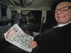 News Corp. chief executive Rupert Murdoch, reads his group's The Sun daily newspaper, as he is driven from his home, in central London, Friday, Feb. 17, 2012. Murdoch is meeting with his British newspaper staff amid police inquiries into alleged misconduct and simmering dissent among the company's rank and file. A total of 10 current and ex-staff at The Sun have been questioned over the alleged payment of bribes to police and defense officials. None have so far been charged.    (AP Photo)