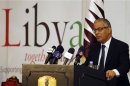 Local council member of the city of Tripoli and member of the Libyan National Council Ali Zeidan speaks during a conference on Libya, in Doha