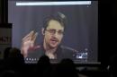 Edward Snowden speaks via video link during a conference at University of Buenos Aires Law School
