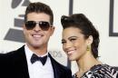 Robin Thicke and Paula Patton arrive at the 56th annual Grammy Awards in Los Angeles