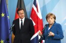 German Chancellor Angela Merkel, right, and Britain's Prime Minister David Cameron brief the media prior to a bilateral meeting at the chancellery in Berlin, Germany, Thursday, June 7, 2012. (AP Photo/Markus Schreiber)