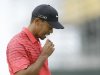 Tiger Woods of the United States checks his scorecard on the second green at Royal Lytham & St Annes golf club during the final round of the British Open Golf Championship, Lytham St Annes, England Sunday, July  22, 2012. (AP Photo/Jon Super)