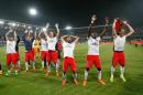Paris Saint-Germain players, celebrate, after defeating Montpellier, and winning the French League One title, at the end of the League One soccer match between Montpellier and Paris Saint-Germain, at the La Mosson Stadium, in Montpellier, southern France, Saturday, May 16, 2015. (AP Photo/Claude Paris)
