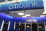 <p>               In this Jan. 6, 2012 photo, a Citibank customer makes a transaction at an ATM, in New York. Citigroup said Tuesday, Jan. 17, 2012, its income fell 11 percent in the fourth quarter of 2011due to lower investment banking income, an accounting charge, and a decline in the value of its assets. (AP Photo/Mark Lennihan)
