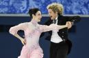 Meryl Davis, left, and Charlie White, of the United States, compete in the ice dance short dance figure skating competition at the Iceberg Skating Palace during the Winter Olympics, Sunday, Feb. 16, 2014, in Sochi, Russia. (AP Photo/The Canadian Press, Paul Chiasson)