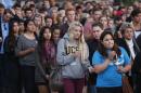 UC Santa Barbara students attend a candlelight vigil following Friday's series of drive-by shootings in Isla Vista