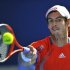 Murray of Britain hits a return to Nishikori of Japan during their quarter-final match at the Australian Open in Melbourne