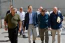 This June 6, 2015 photo provided by New York Gov. Andrew Cuomo's office shows Cuomo, second from left, walking with Steven Racette, left, superintendent of Clinton Correctional Facility, in Dannemora, N.Y. Racette and his deputy in charge of security are among 12 more staff who have been put on administrative leave during the investigation into David Sweat and Richard Matt's escape from the maxiumum-security facility, officials said Tuesday, June 30, 2015. (Darren McGee/Officer of the New York Governor via AP)