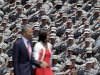 U.S. Army soldiers salute President Barack Obama and first lady Michelle Obama, as they arrive at the Fort Stewart Army post, Friday, April 27, 2012, in Fort Stewart, Ga. (AP Photo/David Goldman)
