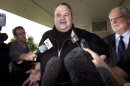 FILE - In this Feb. 22, 2012 file photo, Kim Dotcom, the founder of the file-sharing website Megaupload, comments after he was granted bail and released in Auckland, New Zealand. Indicted Megaupload founder Kim Dotcom has launched a new file-sharing website in a defiant move against the U.S. prosecutors who accuse him of facilitating massive online piracy. The colorful entrepreneur unveiled the "Mega" site ahead of a lavish gala and press conference planned at his New Zealand mansion on Sunday night, Jan. 20, 2013. (AP Photo/New Zealand Herald, Brett Phibbs, File) NEW ZEALAND OUT, AUSTRALIA OUT