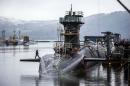 FILE - This Jan. 20, 2016 file photo shows the Vanguard-class submarine HMS Vigilant, one of four Royal Navy submarines armed with Trident missiles, at HM Naval Base Clyde, also known as Faslane, Scotland. British lawmakers are due to vote Monday July 18, 2016, on whether to replace the country's fleet of nuclear-armed submarines, a powerful but expensive symbol of the country's military status. (Danny Lawson/PA via AP)