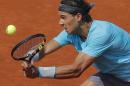 Spain's Rafael Nadal returns the ball to Argentina's Leonardo Mayer during their third round match of the French Open tennis tournament at the Roland Garros stadium, in Paris, France, Saturday, May 31, 2014. (AP Photo/Michel Spingler)