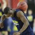Michigan's Tim Hardaway Jr. works with a ball  during practice the NCAA Final Four tournament college basketball semifinal game against Syracuse, Friday, April 5, 2013, in Atlanta. Michigan plays Syracuse in a semifinal game on Saturday. (AP Photo/John Bazemore)