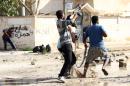 Armed civilians clash with Islamist militiamen in Libya's eastern coastal city of Benghazi on November 2, 2014