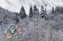 The Olympic rings are covered with freshly fallen snow prior to the cross-country sprint competitions at the 2014 Winter Olympics, Wednesday, Feb. 19, 2014, in Krasnaya Polyana, Russia. (AP Photo/Matthias Schrader)