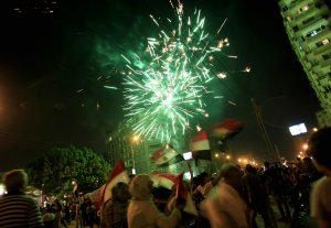 Fireworks light the sky as opponents of Egypt's Islamist …
