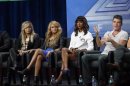 Judge Simon Cowell speaks next to fellow judges (from L-R) Demi Lovato, Paulina Rubio and Kelly Rowland at a panel for the television series "The X Factor" during the Fox portion of the Television Critics Association Summer press tour in Beverly Hills, California August 1, 2013. REUTERS/Mario Anzuoni