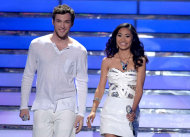 FILE - In this May 23, 2012 file photo, finalists Phillip Phillips, left, and Jessica Sanchez appear onstage at the "American Idol" Finale in Los Angeles. “Idol” winner Phillip Phillips will receive the same $300,000 advance given to last year's winner Scotty McCreery upon completion of his first album, according to the contracts. Coming in second on “American Idol” as Sanchez has, may still be a path to superstardom, but it no longer offers guaranteed paychecks worthy of the next pop idol or rock star. (Photo by John Shearer/Invision/AP, File)