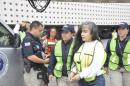 Avila Beltran is watched over by members of the Ministerial Federal Police after her arrival at Benito Juarez International Airport in Mexico