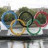 Giant Olympic rings are pictured on a barge floating on the River Thames in London