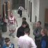 In this photo made taken from Feb. 4, 2012 security camera footage provided by Bismarck Schools, a man identified as 28-year-old Sherwin Shayegan of Bothell, Wash., dressed in a basketball uniform, stands in a hallway at Century High School in Bismarck, N.D. Dubbed the Piggyback Bandit, Shayegan crashed school sporting events in at least five states from Washington to Minnesota, in some cases coaxing players to give him a piggyback ride. (AP Photo/Bismarck Schools)