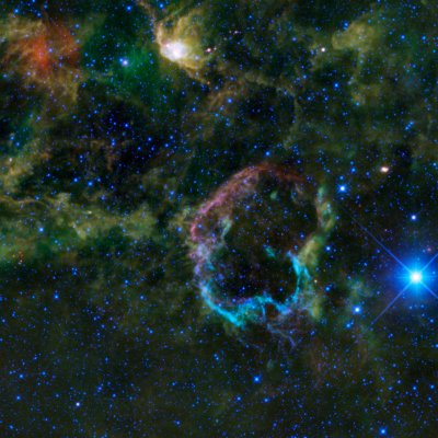 This image provided by NASA Thursday Dec. 9, 2010 shows this oddly colorful nebula which is the supernova remnant IC 443 as seen by NASA's Wide-field Infrared Survey Explorer, or WISE. Also known as the Jellyfish nebula, IC 443 is particularly interesting because it provides a look into how stellar explosions interact with their environment. IC 443 can be found near the star Eta Geminorum, which lies near Castor, one of the twins in the constellation Gemini. (AP Photo/NASA)