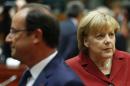 Germany's Chancellor Merkel and France's President Hollande attend a European Union leaders summit in Brussels
