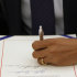 President Barack Obama signs the payroll tax cut extension, Friday, Dec. 23, 2011, in the White House Oval Office in Washington. (AP Photo/Haraz N. Ghanbari)