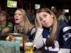 Kerry Harrington, center, and Sara Laporte, right, both of Boston, react while watching the NFL football Super Bowl game between the New York Giants and the New England Patriots on television at a bar in Boston, Sunday, Feb. 5, 2012. The Giants won 21-17. (AP Photo/Michael Dwyer)
