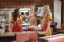 In this image released by CBS, Kat Dennings, left, and Beth Behrs are shown in a scene from the comedy series "2 broke Girls," premiering Sept. 19, 2011 on CBS. (AP Photo/CBS, Richard Cartwright)