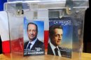 Brochures for the two leading French presidential candidates are seen in an urn in Bethune