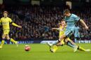Manchester City's English midfielder James Milner (R) scores a goal against Sheffield Wednesday at The Etihad Stadium in Manchester, north west England on January 4, 2015