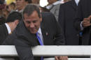 New Jersey Gov. Chris Christie reaches over a stadium railing to shake hands with cheering students as he visits a school in Puebla, Mexico, Friday, Sept. 5, 2014. On the last day of Christie's three-day visit to Mexico, the potential 2016 contender put his people skills to the test in the city of Puebla, where students packed the bleachers of an outdoor field waving Mexican, American, and New Jersey Flags. (AP Photo/Rebecca Blackwell)