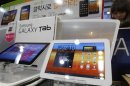 A customer looks at Samsung Electronics' Galaxy Tab at a store in Seoul