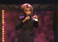 In this photo provided by the Las Vegas News Bureau, Whitney Houston performs during the Billboard Awards at the MGM Grand in Las Vegas on Dec. 7, 1998. Often referred to as the Queen of Pop music at her best, Houston ex-wife of singer Bobby Brown, died Saturday, Feb. 11, 2012 at the age of 48. (AP Photo/Las Vegas News Bureau)