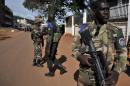Soldiers of the multinational African force (FOMAC) stands guard in front of a house on October 7, 2013 in Bangui