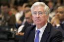 FILE - This is a Saturday, June 4, 2016 file photo of British Defense Secretary Michael Fallon as he attends the 15th International Institute for Strategic Studies Shangri-la Dialogue, or IISS, Asia Security Summit in Singapore. Michael Fallon said Monday July 18, 2016 that Britain will have to work harder to maintain its military and political influence on the global stage after it leaves the European Union. ﻿﻿ (AP Photo/Wong Maye-E, File)