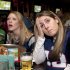 Kerry Harrington, center, and Sara Laporte, right, both of Boston, react while watching the NFL football Super Bowl game between the New York Giants and the New England Patriots on television at a bar in Boston, Sunday, Feb. 5, 2012. The Giants won 21-17. (AP Photo/Michael Dwyer)