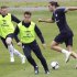 England's Andy Carroll, right, Scott Parker, center, and Wayne Rooney vie for the ball during a training session in Krakow, Poland, Friday, June 22, 2012. England will play Italy in a Euro 2012 quarterfinal soccer match on Sunday in Ukraine. (AP Photo/Kirsty Wigglesworth)