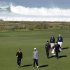 Tiger Woods, front right, walks with his coach, Sean Foley, front left, up to the 10th green of the Monterey Peninsula Country Club shore course during a practice round at the Pebble Beach National Pro-Am golf tournament in Pebble Beach, Calif., Wednesday, Feb. 8, 2012. (AP Photo/Eric Risberg)