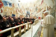 Pope Benedict XVI addresses cardinals and prelates at the Vatican, on February 23, 2013. He thanked members of the Curia, adding that "even though our external visible communion is coming to an end, there remains a spiritual proximity, there remains a profound communion in prayer"