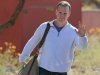 NFL quarterback Peyton Manning leaves the Arizona Cardinals training facility after a five hour meeting with coaches and front office staff Sunday, March 11, 2012, in Tempe, Ariz.(AP Photo/Ross D. Franklin)