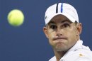 Roddick of the U.S. gets set to hit a return to Tomic of Australia during their match at the US Open men's singles tennis tournament in New York