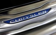 The Chrysler logo is shown on a new Chrysler 200 on the showroom at the Massey-Yardley Chrysler, Dodge, Jeep and Ram automobile dealership in Plantation, Florida October 8, 2013. REUTERS/Joe Skipper