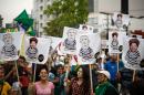 Demonstrators protest against Brazilian President Dilma Rousseff with signs depicting her and former Brazilian president Luiz Inacio Lula da Silva in Sao Paulo, Brazil on October 19, 2015