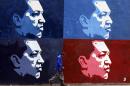 A man walks in front of graffiti depicting late Venezuelan President Hugo Chavez in Caracas on March 11, 2015