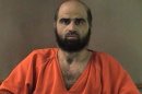 FILE - This undated file photo provided by the Bell County Sheriff's Department shows Nidal Hasan, the Army psychiatrist charged in the deadly 2009 Fort Hood shooting rampage that left 13 dead. A military judge said Friday, June 14, 2013, that she will not allow Hasan to tell jurors that he shot Fort Hood soldiers to protect Taliban leaders in Afghanistan. Col. Tara Osborn said that Hasan's defense of others strategy fails as a matter of law. (AP Photo/Bell County Sheriff's Department, File)