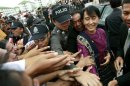 Myanmar opposition leader Aung San Suu Kyi arrives at a national verification center for Myanmar migrant workers in Samut Sakhon Province, Thailand on Thursday, May 31, 2012. (AP Photo/Wason Wanichakorn)
