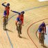 Britain's Joanna Rowsell, left, Danielle King, center, and Laura Trott celebrate winning the women's team pursuit at the Track Cycling World Championships in Melbourne, Australia, Thursday, April 5, 2012. Britain won the final over Australia in the world record time of 3:15.720. (AP Photo/Rick Rycroft)