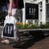 FILE - This file photo taken Aug. 17, 2011, shows a shopper leaving the Gap store in Freeport, Maine. Shoppers who are just as concerned about quality as price are flocking to factory outlets, where they can snag Gap, Burberry and other designer clothes and accessories for to 25 to 90 percent off. (AP Photo/Pat Wellenbach, File)